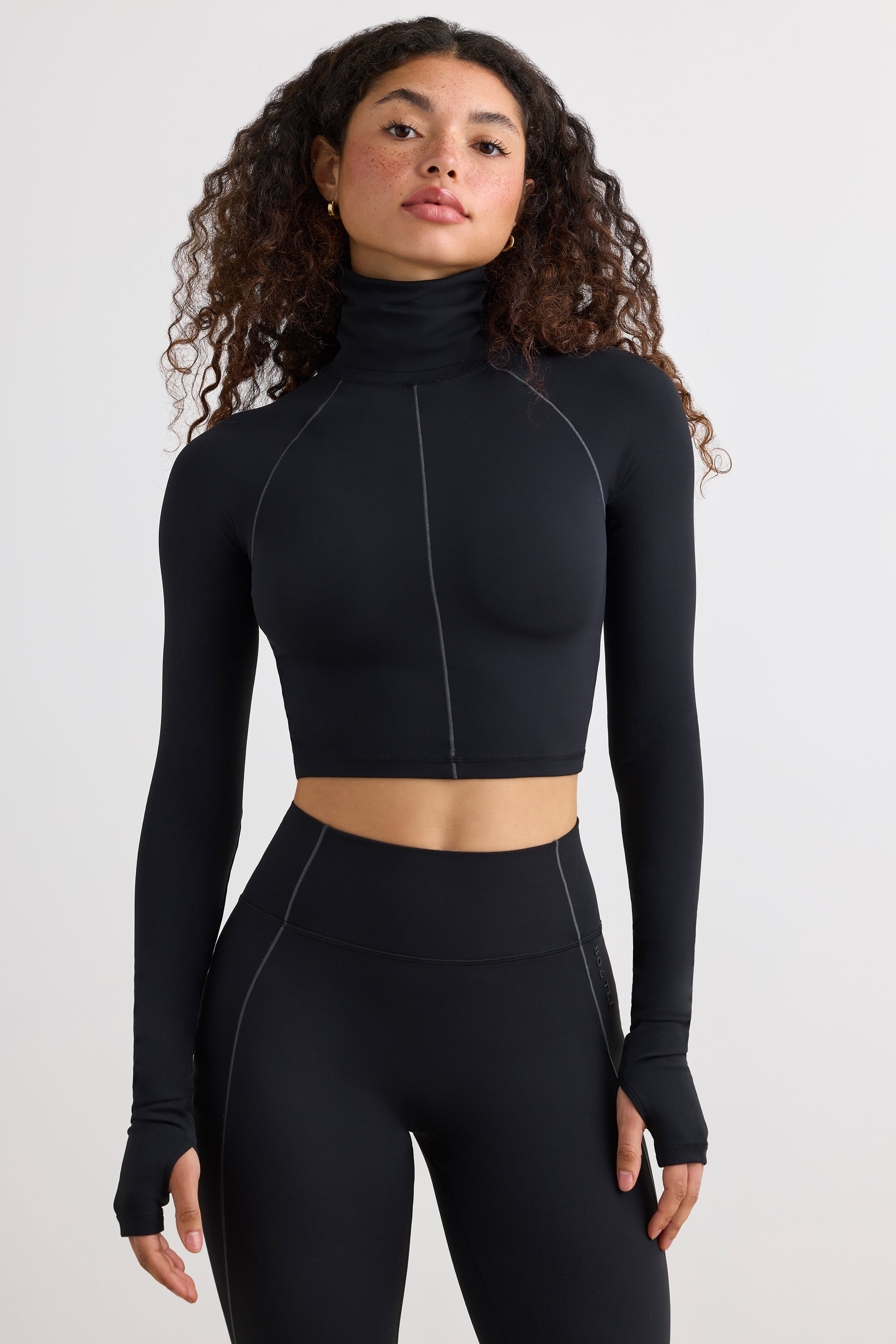 Soft Active Turtleneck Crop Top in Black - Main Image