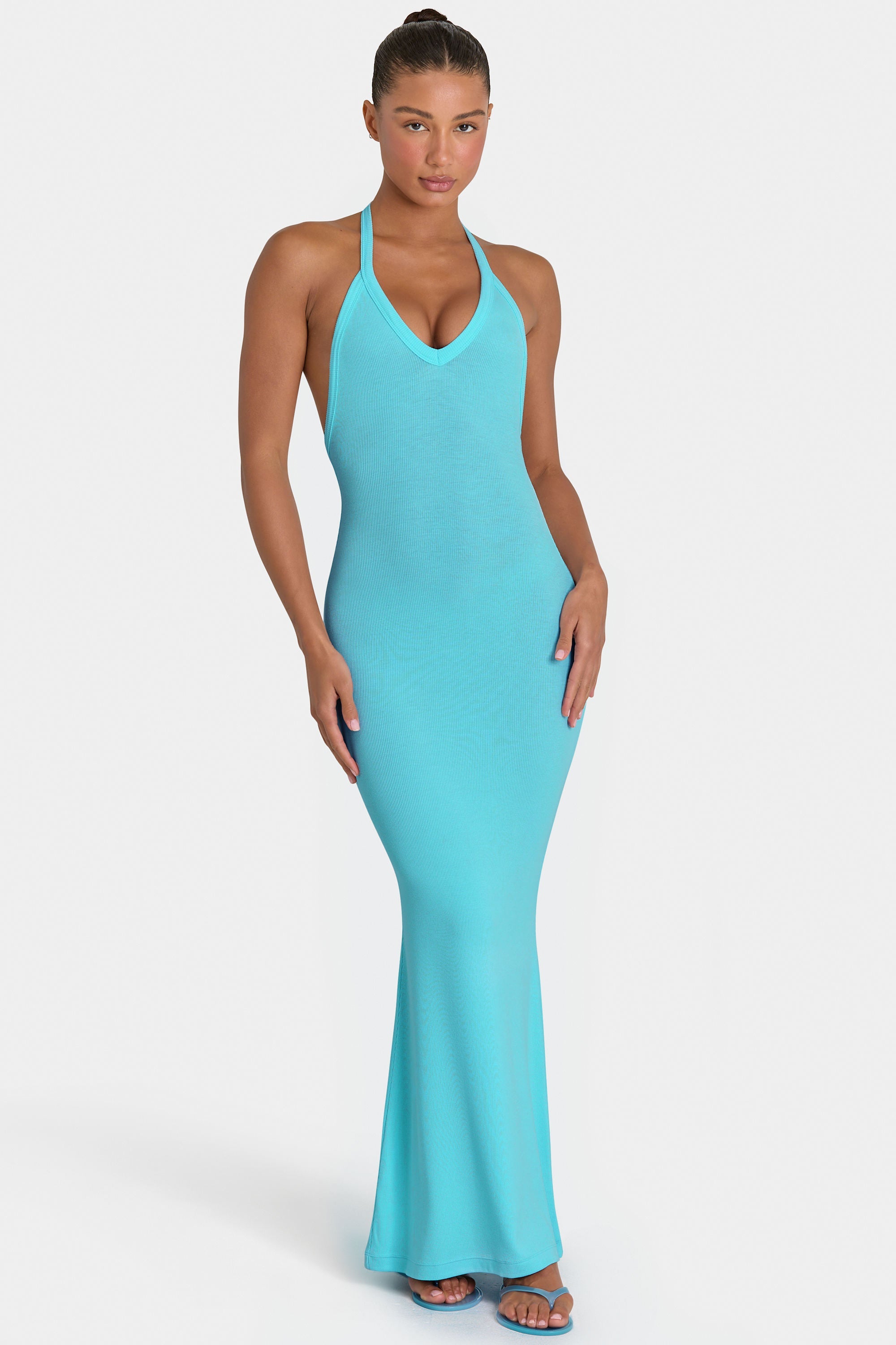 aqua by aqua maxi dress Crafted from a shimmering stretch fabric ButterCloud Maxi Dress in Aqua