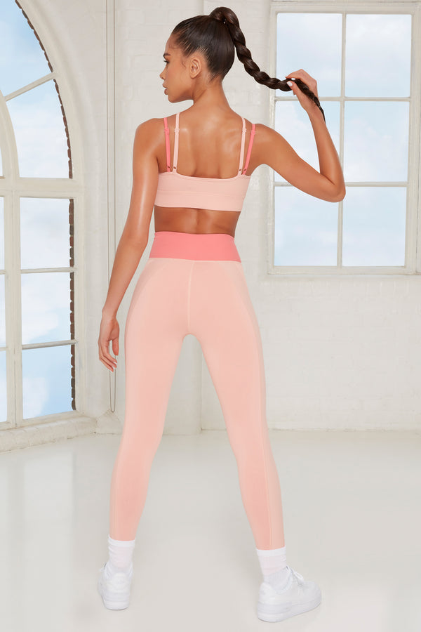 model showing back of two toned womens gym leggings and crop top