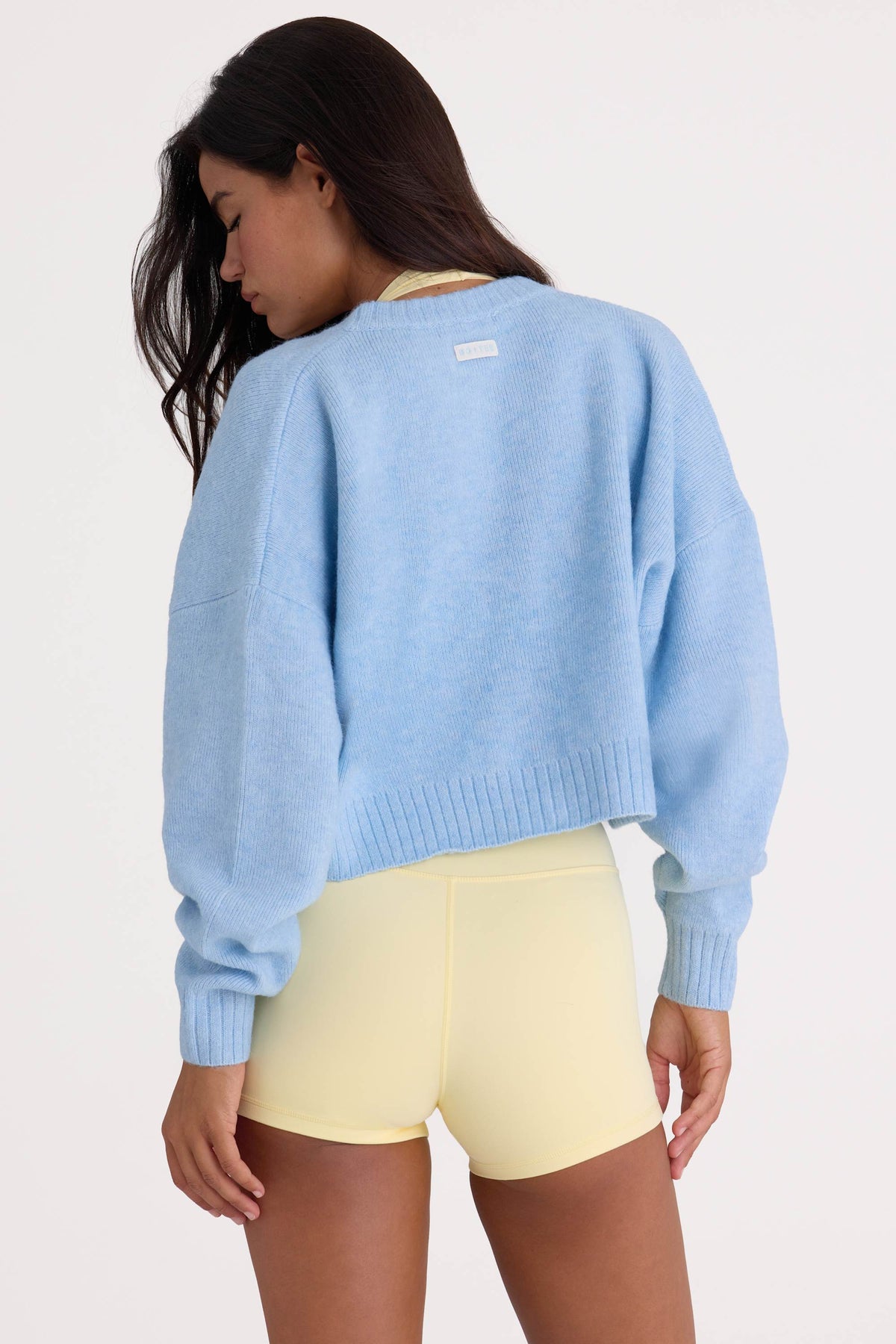 Bo+Tee model Nikki wearing the Christmas Knits Cardigan in Powder Blue Knitwear fabric perfect for festive office parties