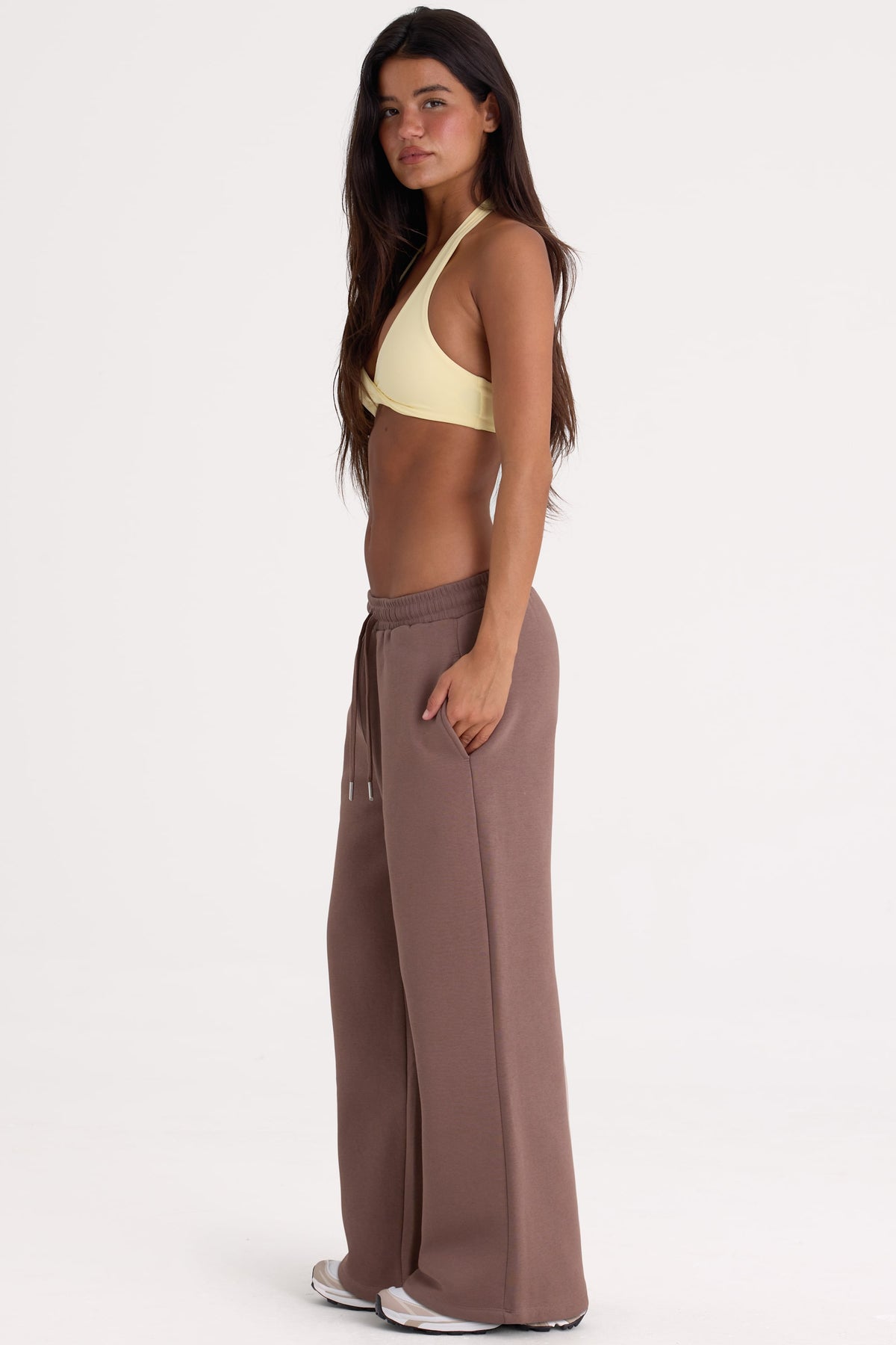 Bo+Tee model Lydia Butler wearing the CosyCoffeeRunWithLydsButler Joggers in Cocoa Brushback sweat fabric perfect for weekend lounging