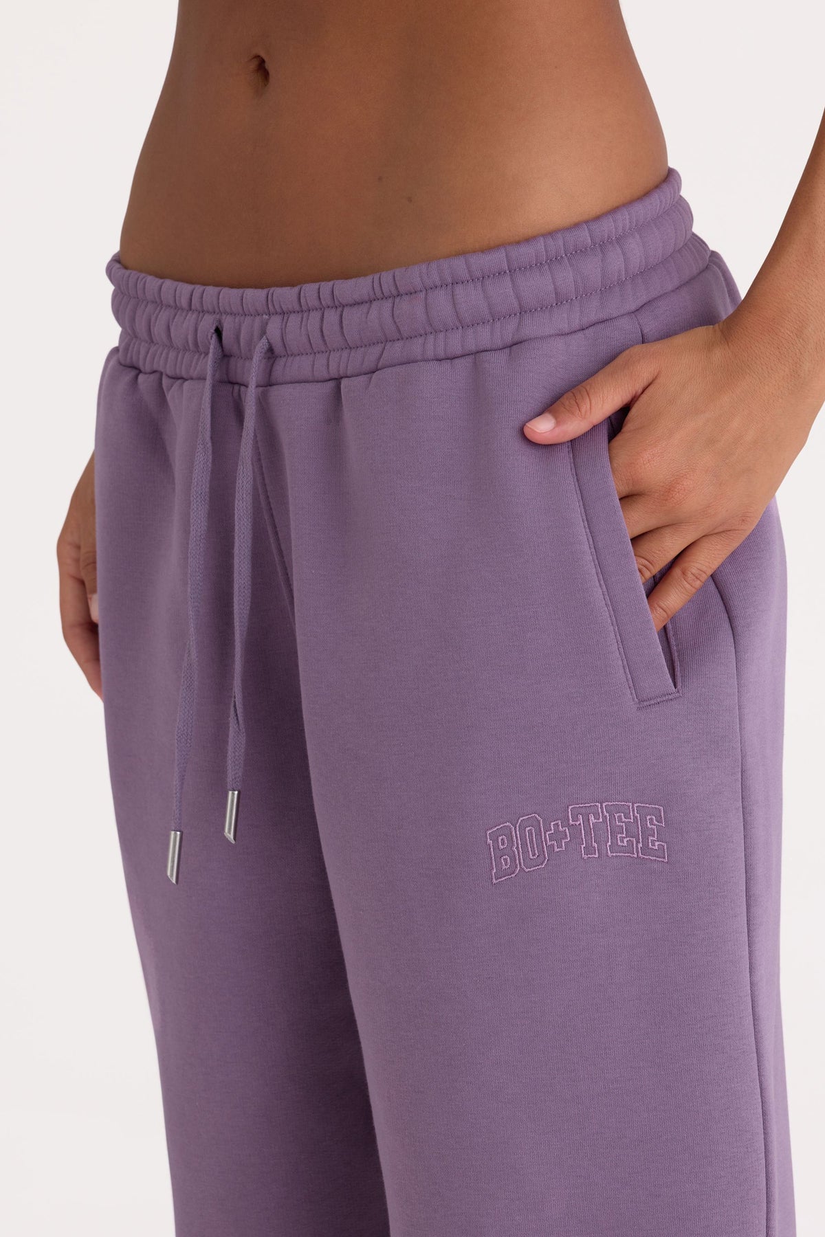 Bo+Tee model Lydia Butler wearing the CosyCoffeeRunWithLydsButler Joggers in Dusk Brushback sweat fabric perfect for gym commutes