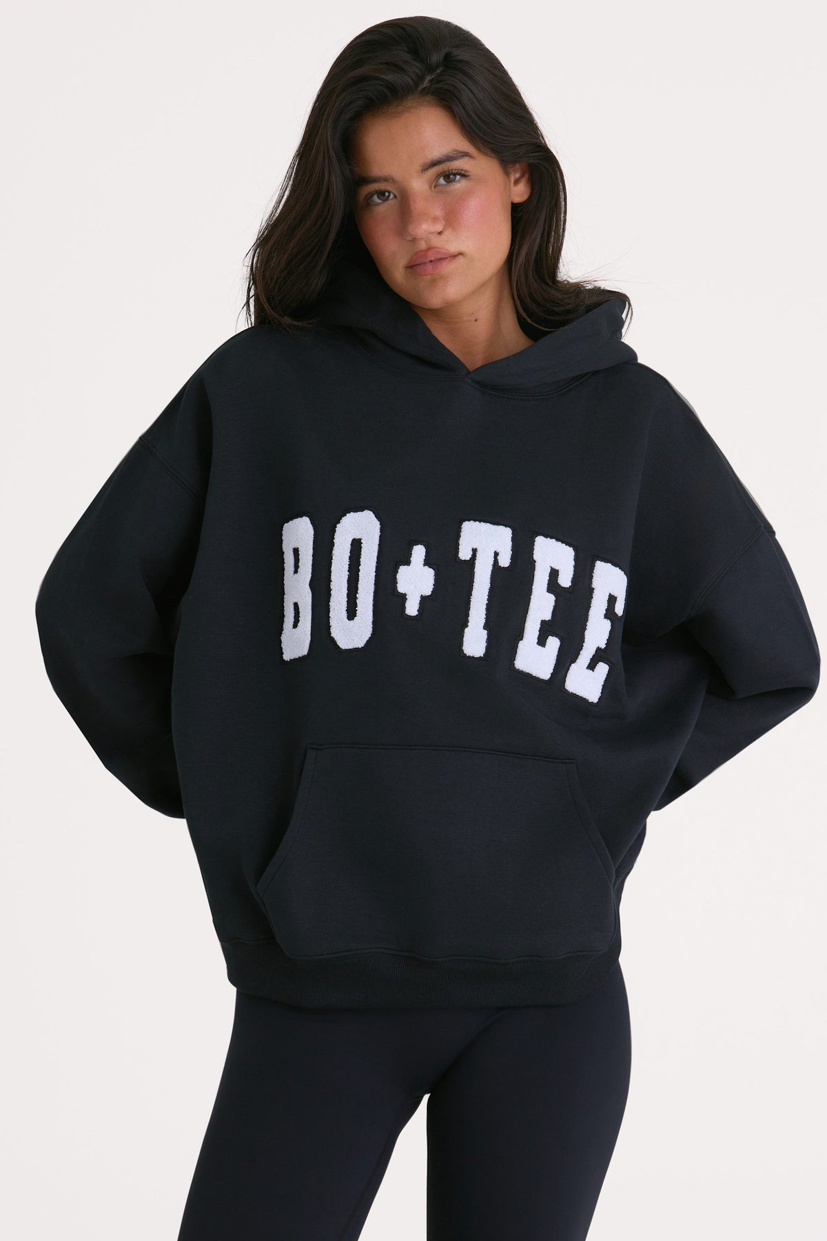 Bo+Tee model Kiele wearing the Off-Duty Hoodie in Black Cotton fabric perfect for casual outings