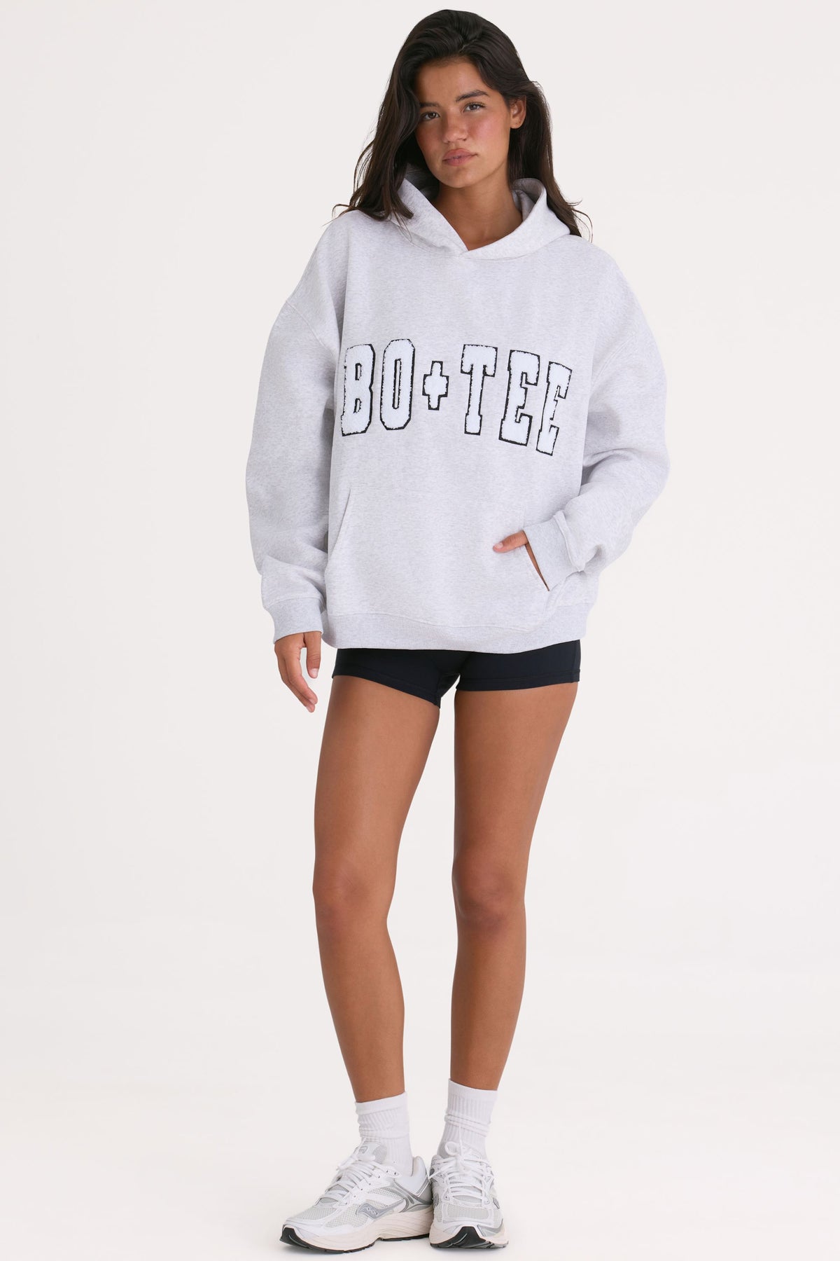 Bo+Tee model Cristal wearing the Off-Duty Hoodie in Heather Grey Cotton fabric perfect for gym sessions