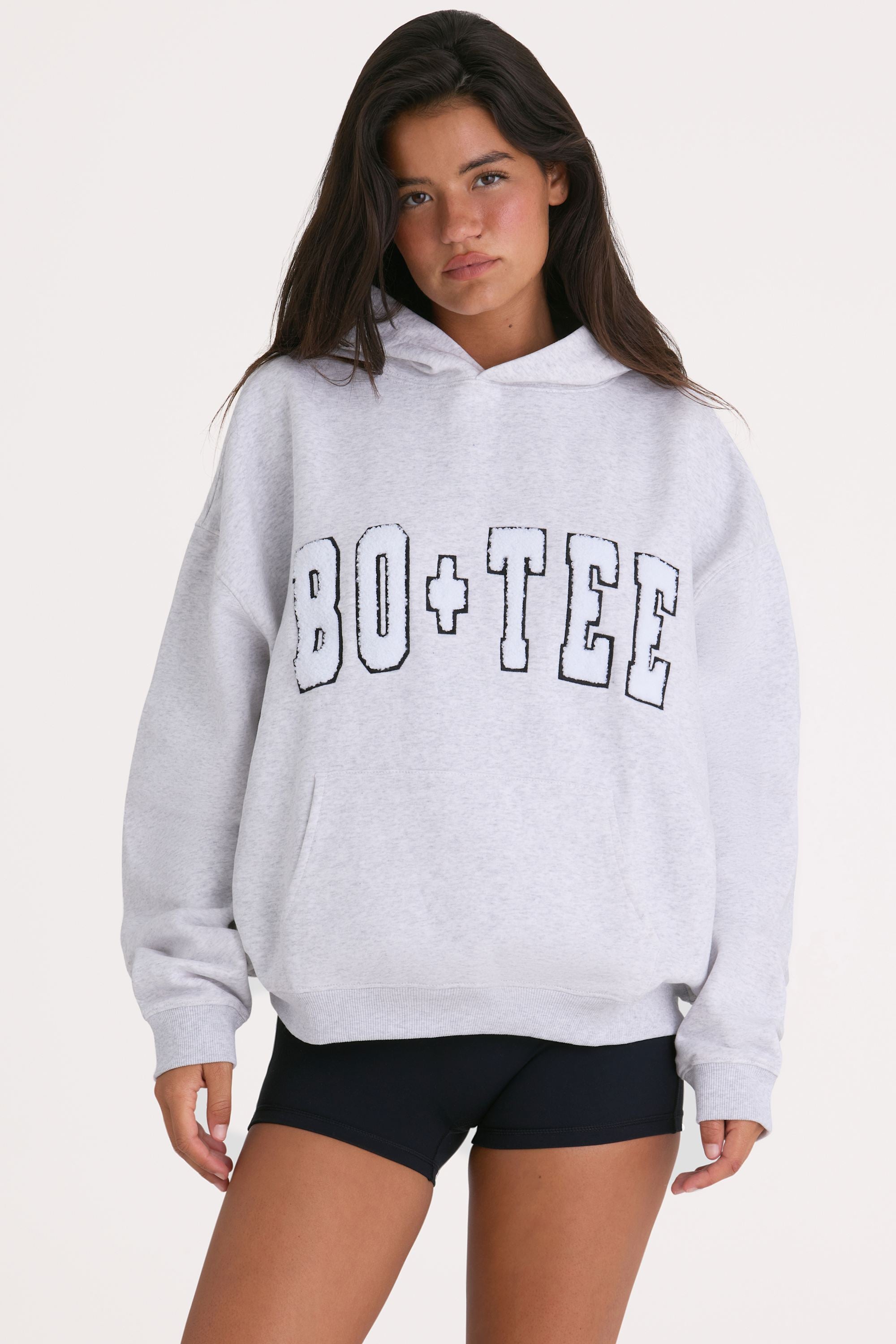 Bo+Tee model Kiele wearing the Off-Duty Hoodie in Heather Grey Cotton fabric perfect for casual outings