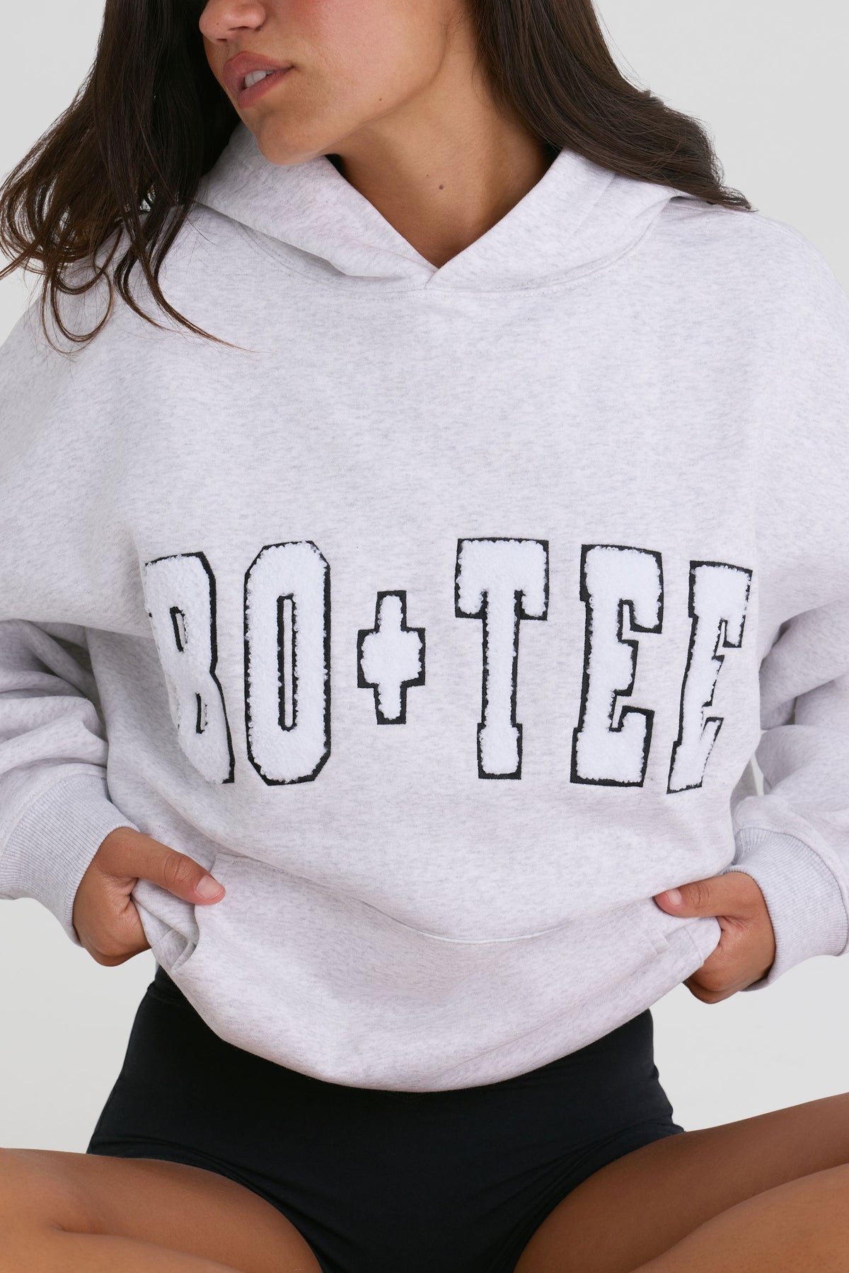 Bo+Tee model Kiele wearing the Off-Duty Hoodie in Heather Grey Cotton fabric perfect for coffee runs