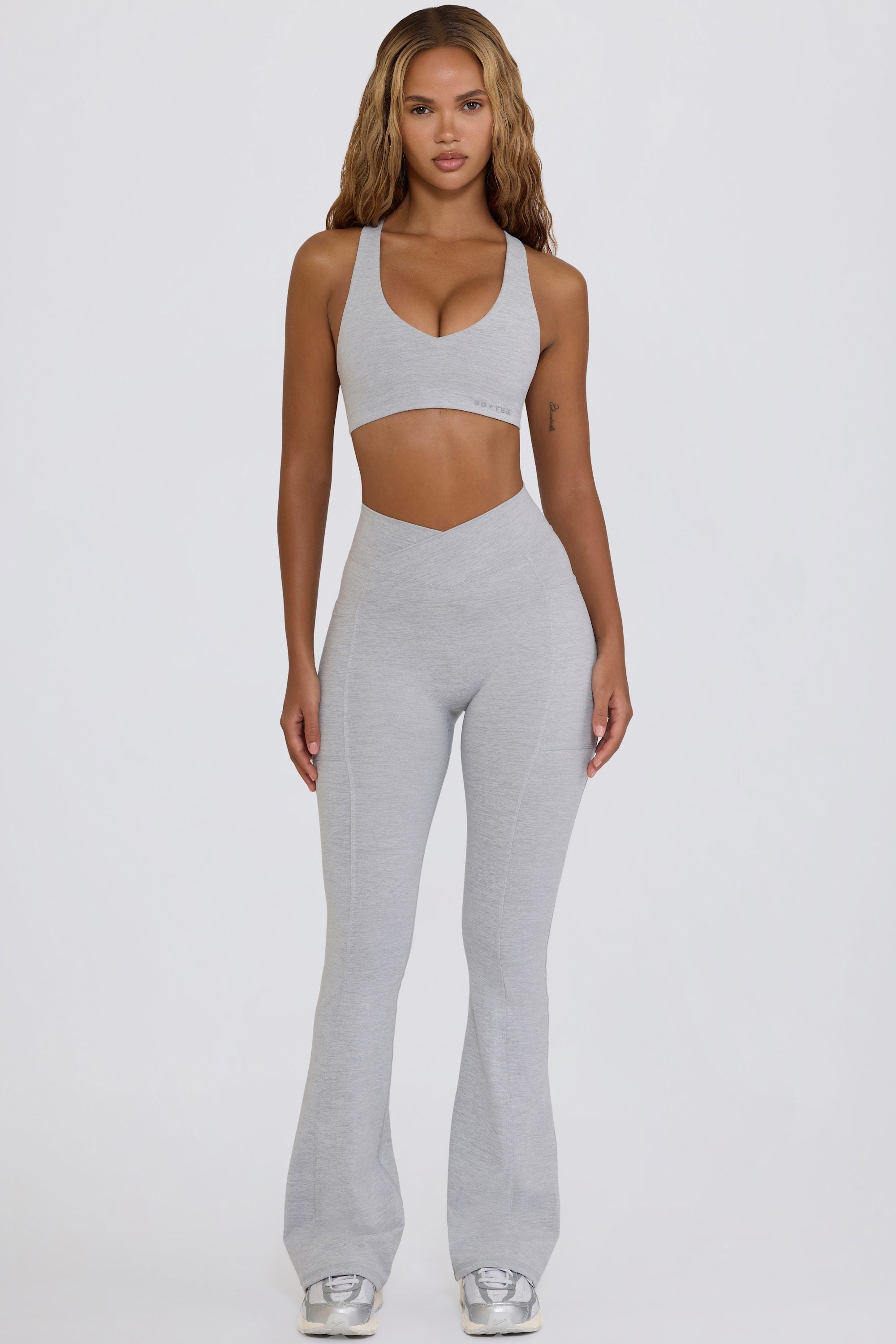 Bo+Tee model Hayley wearing the WithLovePerfectMatch Leggings in Grey Marl Soft Active (Cut & Sew) fabric perfect for pilates and stretching