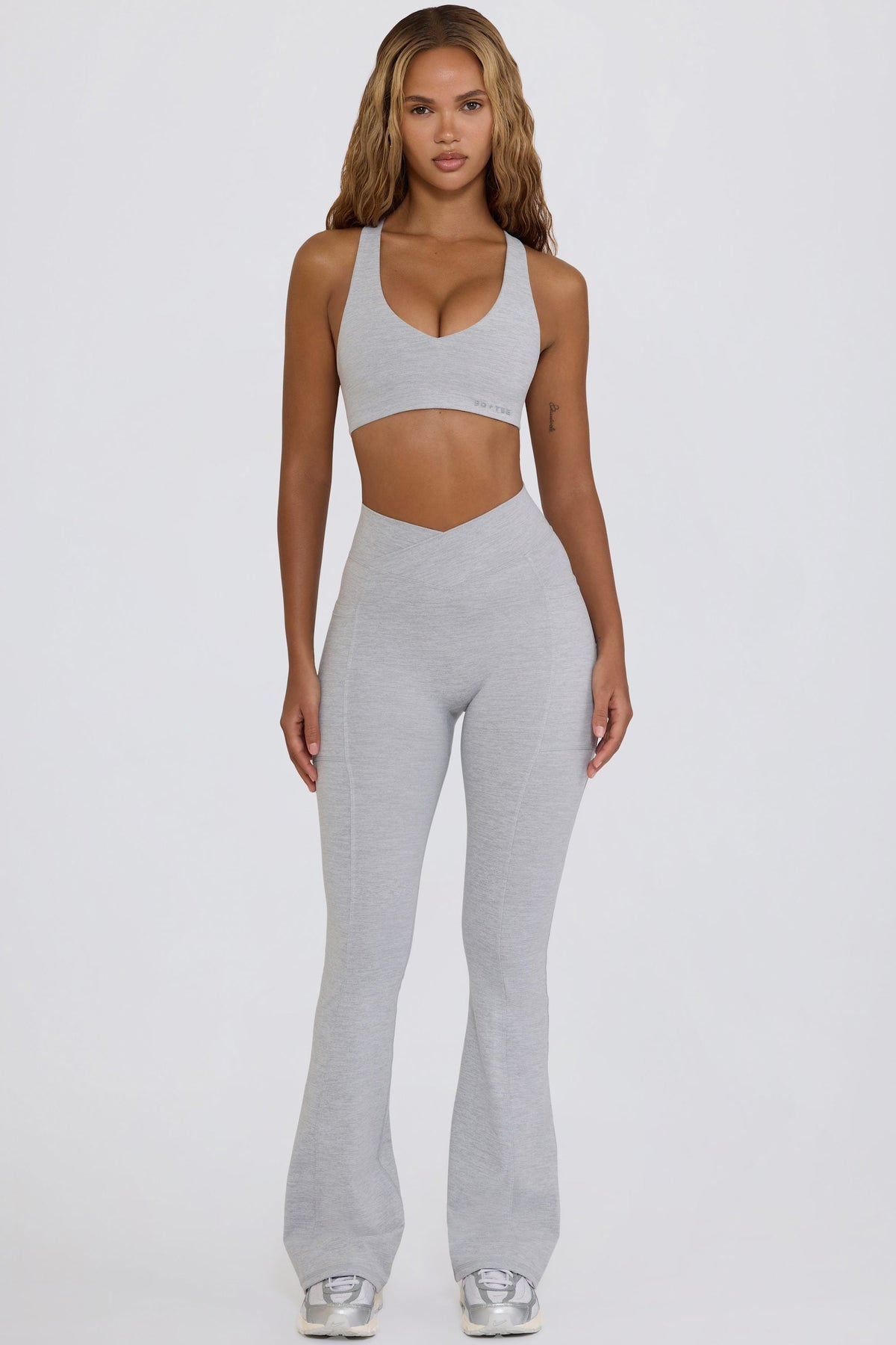 Bo+Tee model Hayley wearing the WithLovePerfectMatch Leggings in Grey Marl Soft Active (Cut & Sew) fabric perfect for pilates and stretching