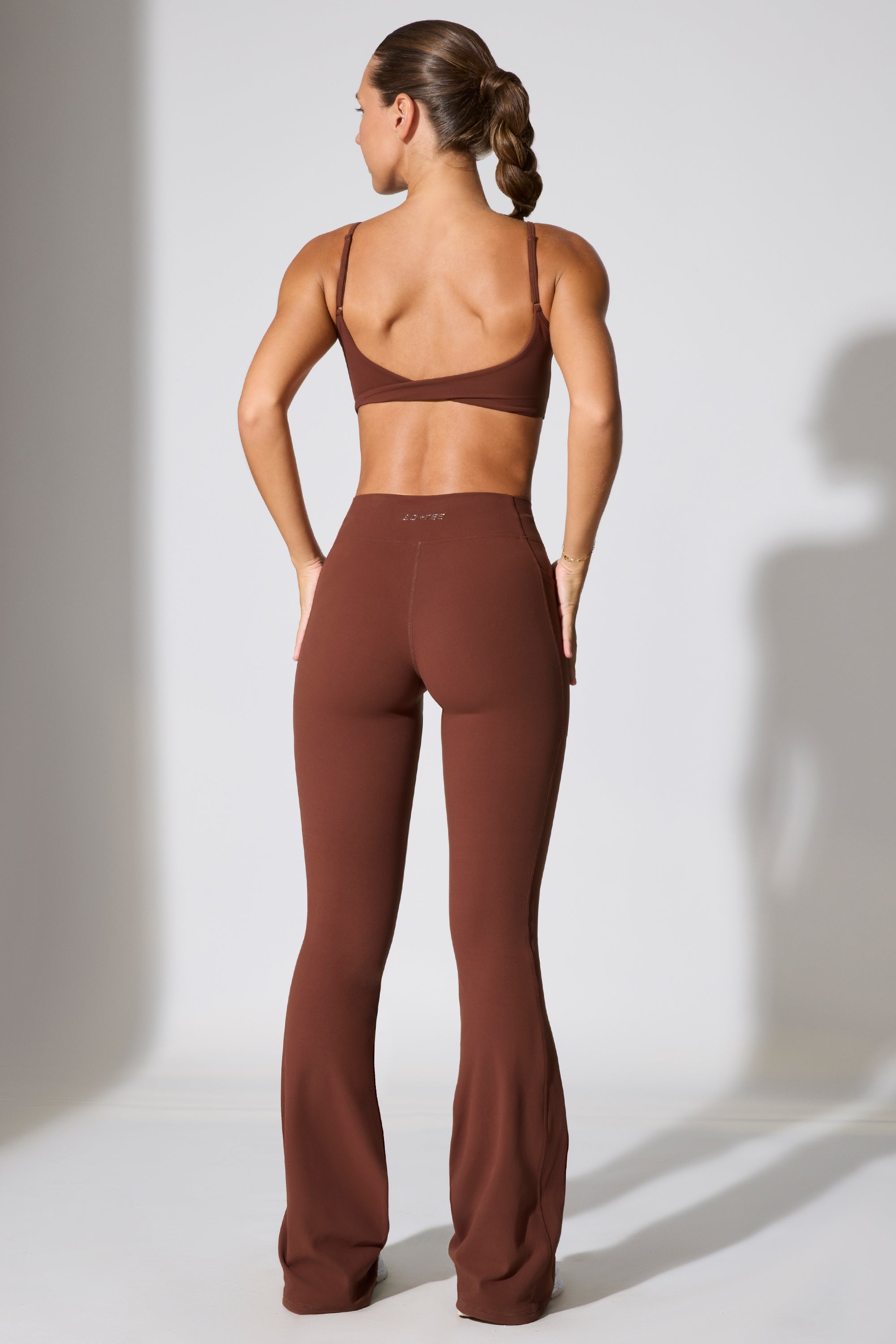 Realign - Twist Waist Flare Leggings in Chocolate