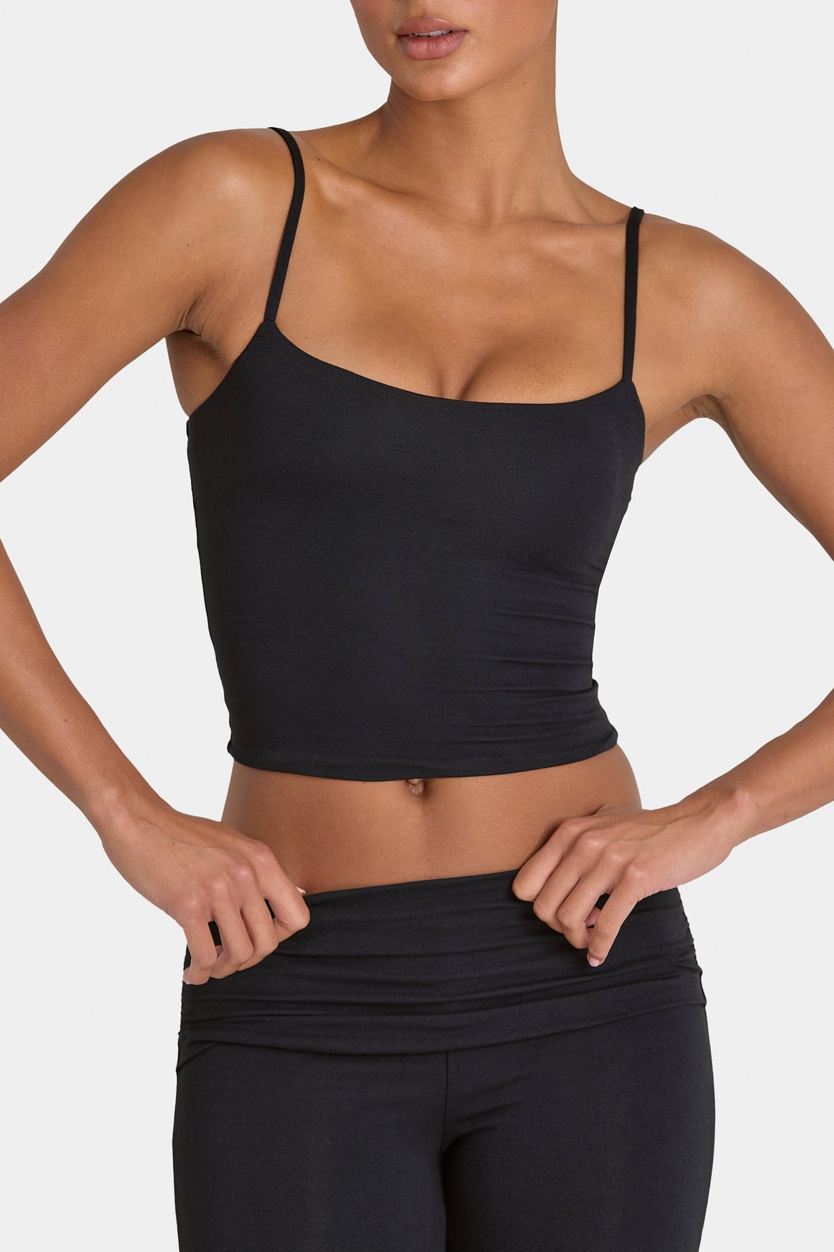 Bo+Tee model Hayley wearing the Rebloom Full Top in Black Modal fabric perfect for yoga sessions