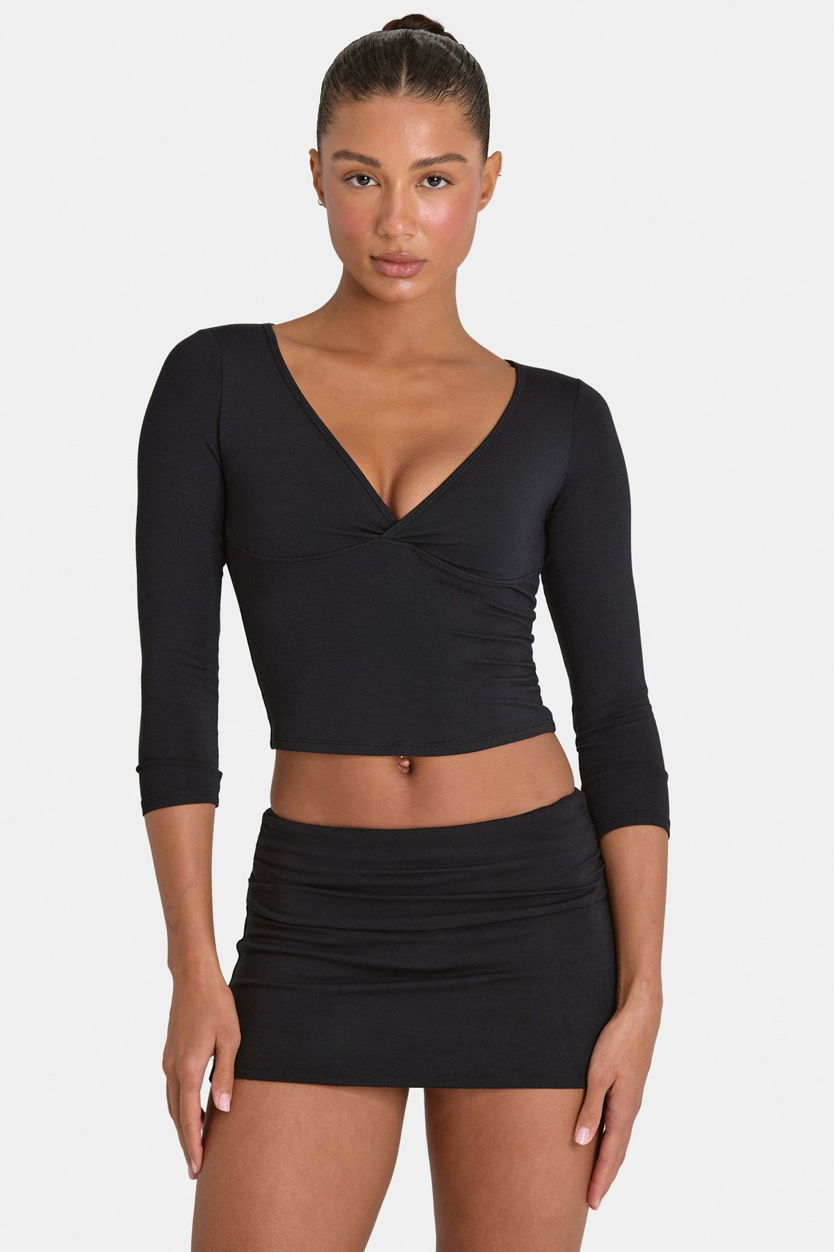 Bo+Tee model Kiele wearing the BT16355__Black Skirt in Black Modal fabric perfect for dinner with friends