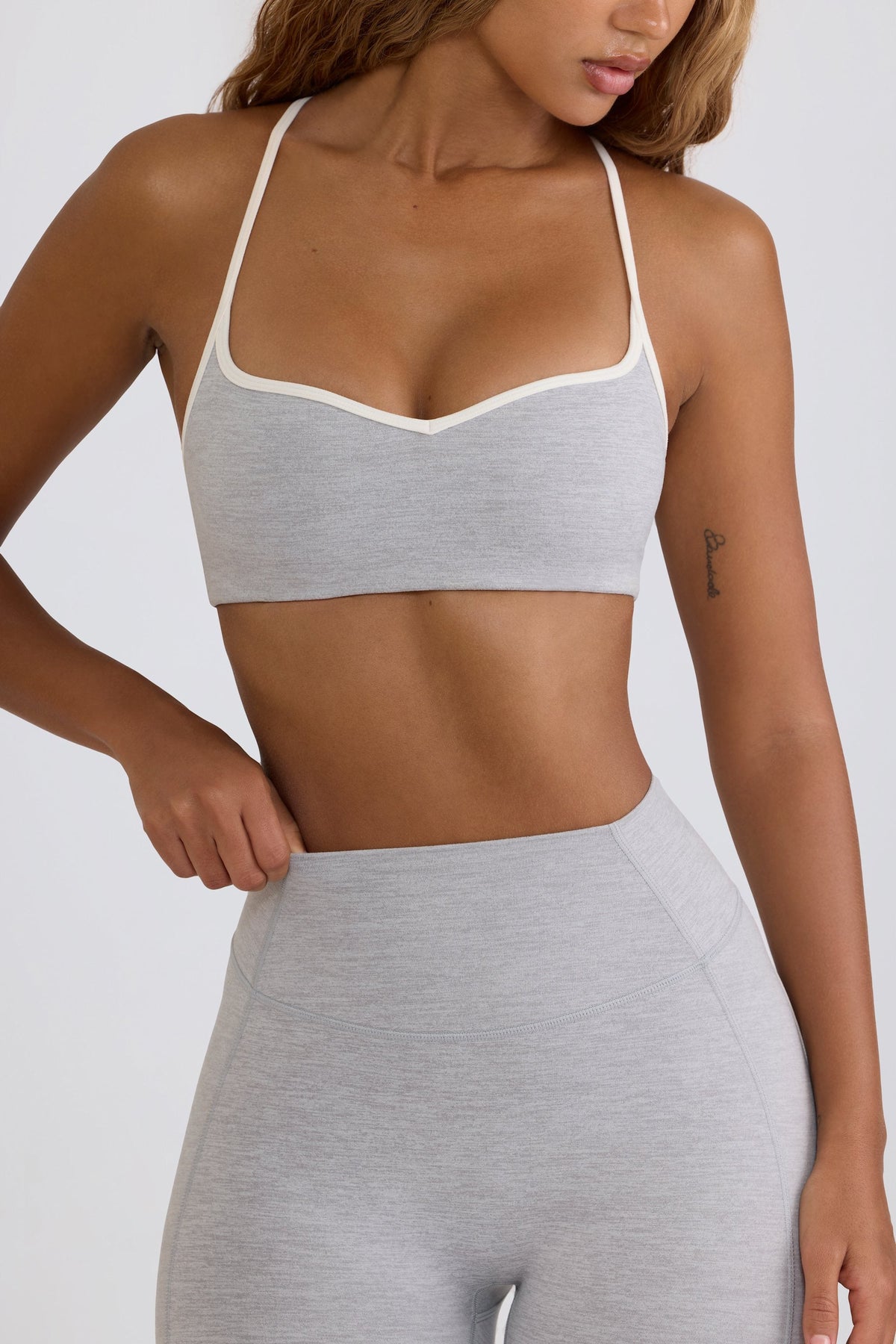 Bo+Tee model Hayley wearing the WithLovePerfectMatch Sports Bra in Grey Marl Soft Active (Cut & Sew) fabric perfect for pilates class