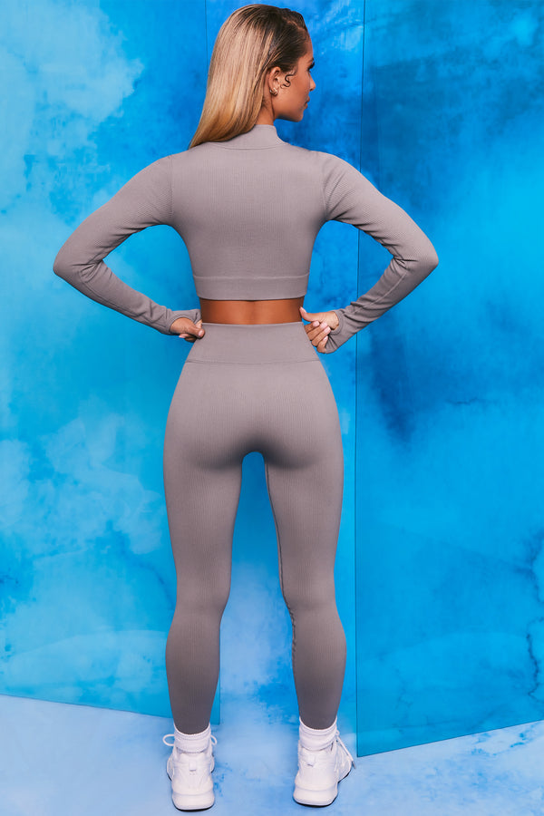 Plain grey ribbed high neck crop top with zip front and long sleeves. Image 3 of 6