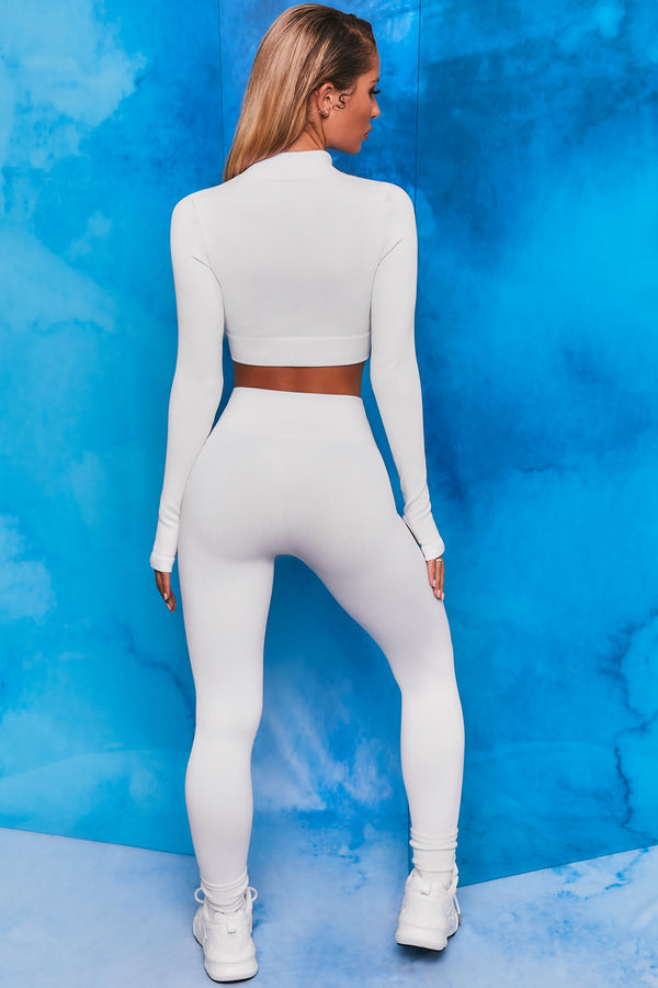 Plain white ribbed high neck crop top with zip front and long sleeves. Image 3 of 6