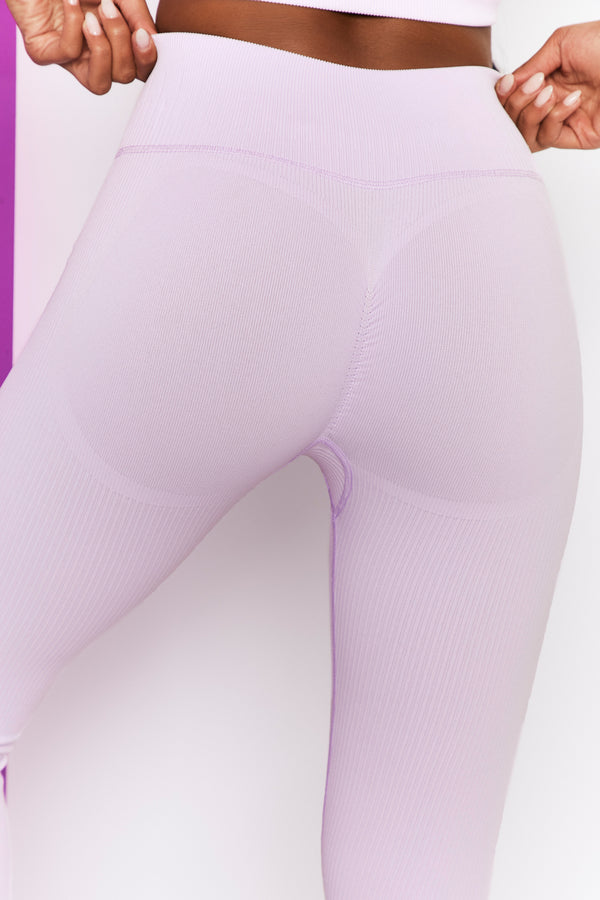 close up of back of womens gym leggings in lilac