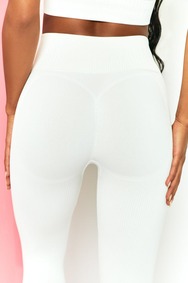 back view of womens gym leggings in white
