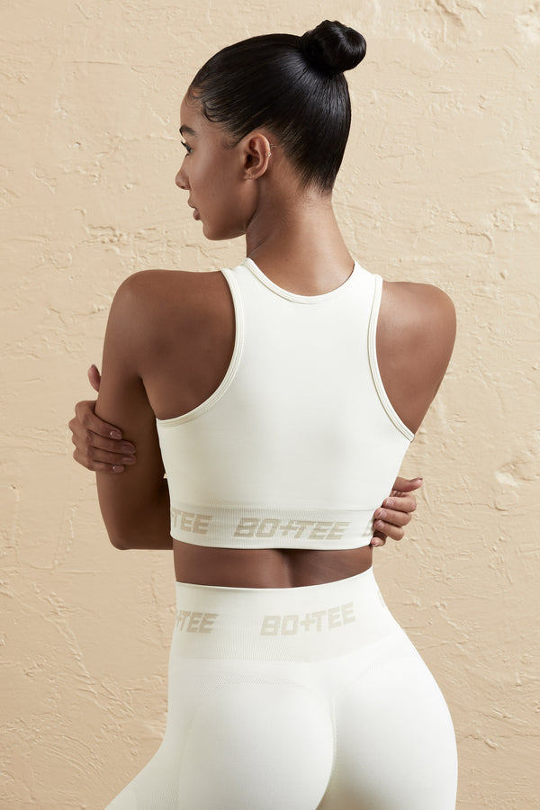 Knockout - Seamless Racerback Crop Top in Cream