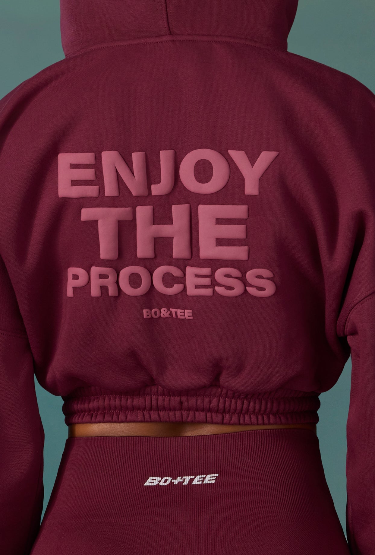Progess Cropped Drawstring Hooded Sweatshirt in Plum | Bo+Tee Progess Cropped Drawstring Hooded Sweatshirt in Plum | Bo+Tee