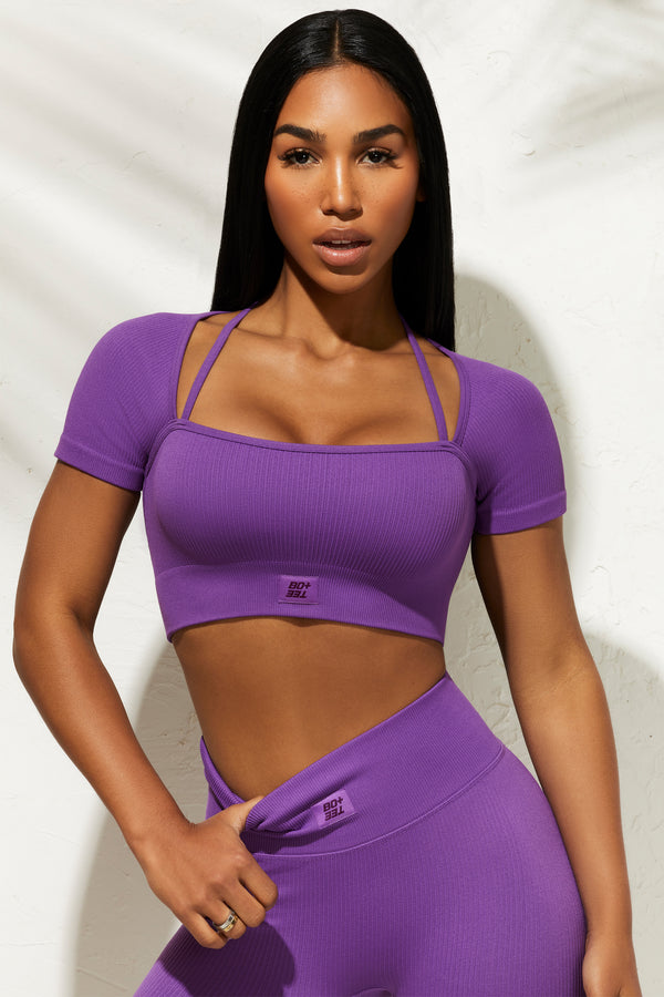 model wearing womens short sleeve gym crop top in purple